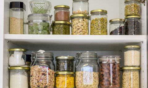 Jars of food in glass containers in a pantry