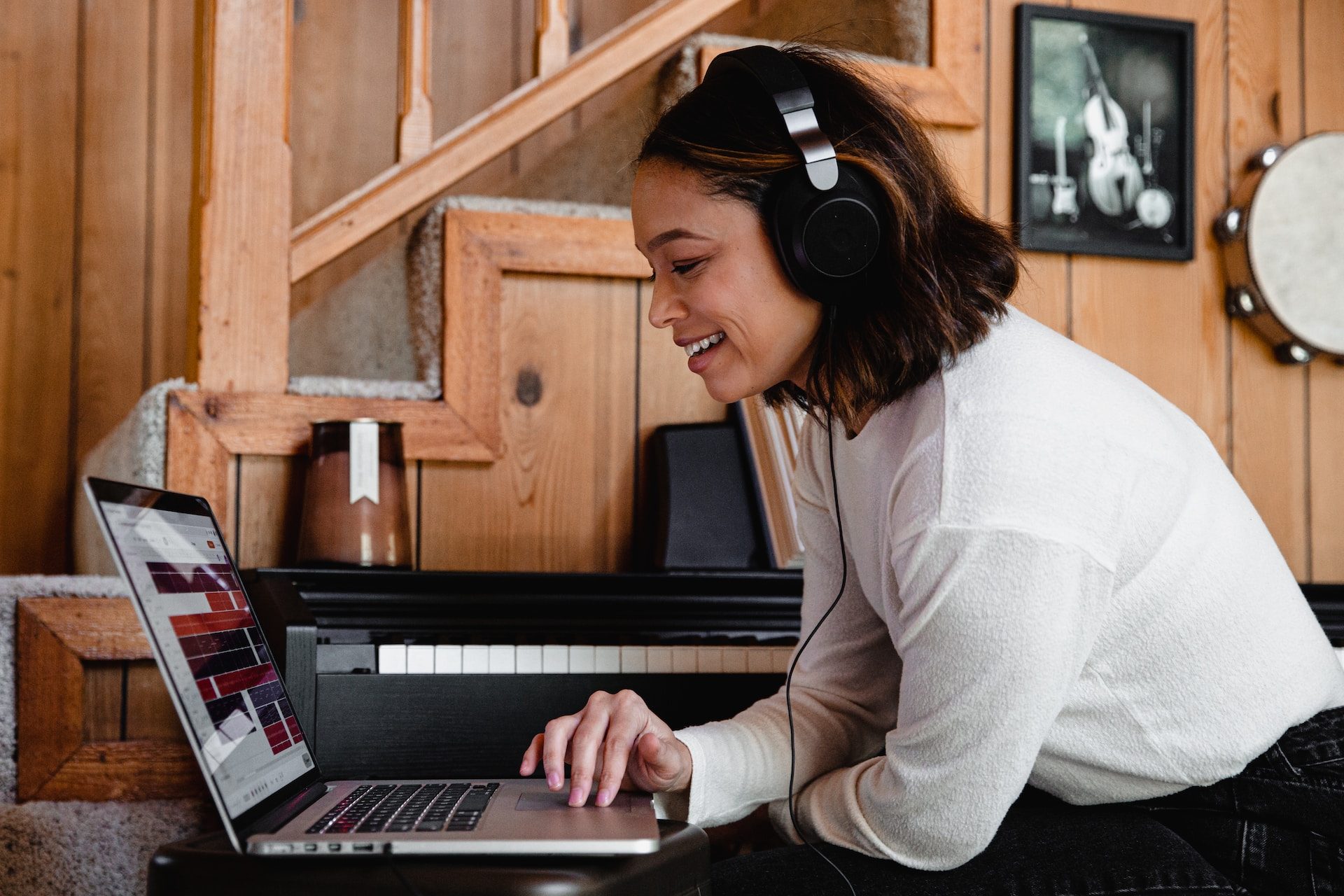 A person listening to music on a laptop.