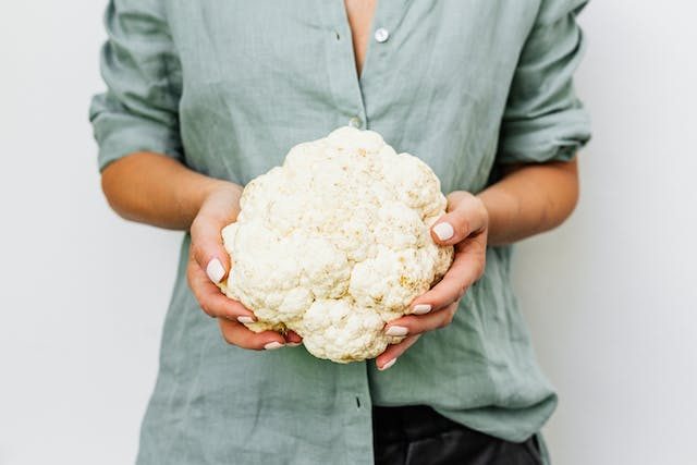 Woman holding cauliflower