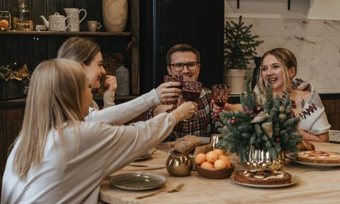 Friends eating around table