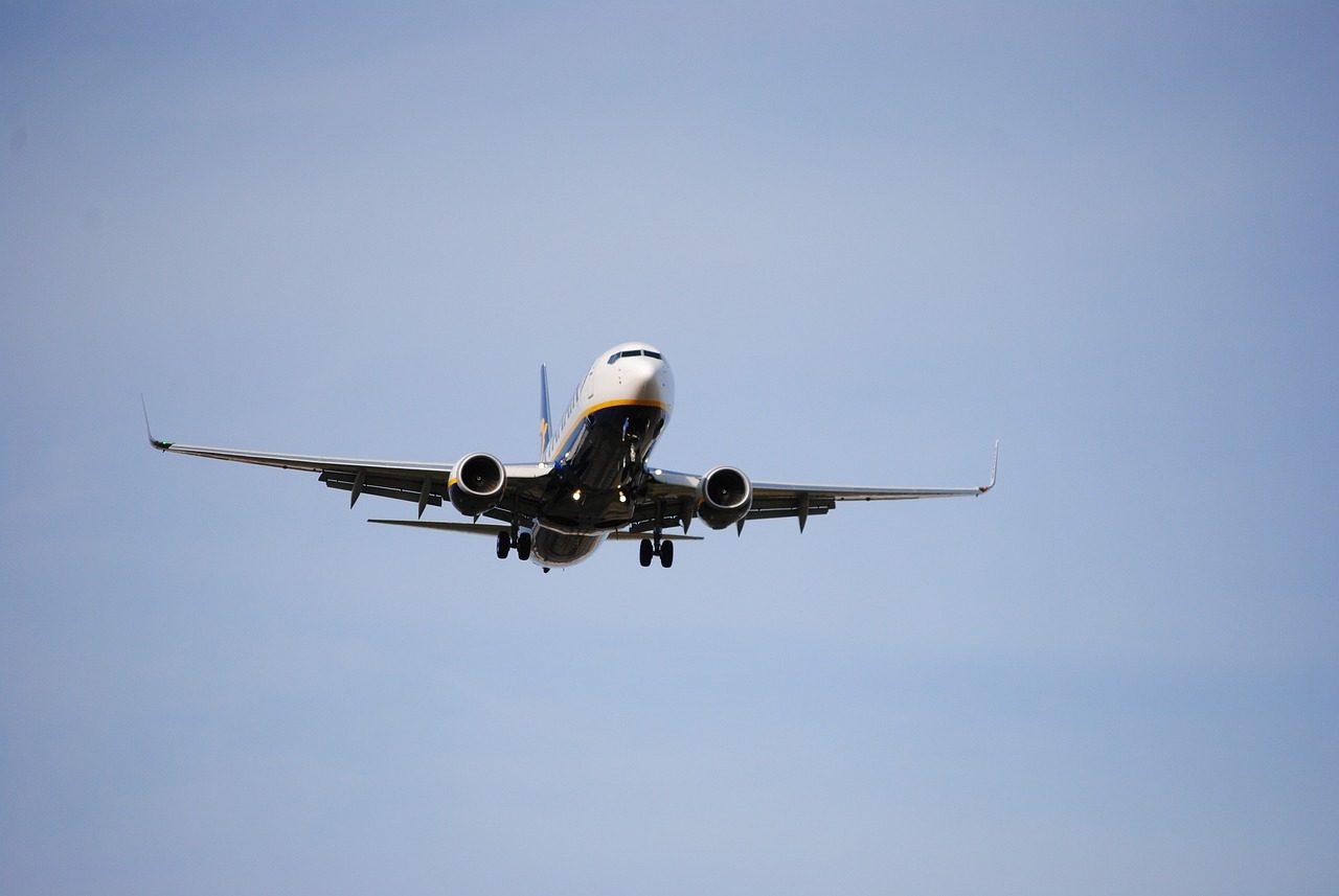 An airplane midflight as seen from below