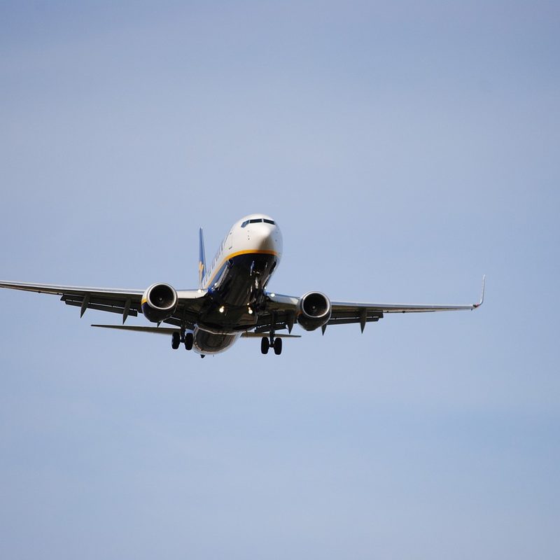 An airplane midflight as seen from below