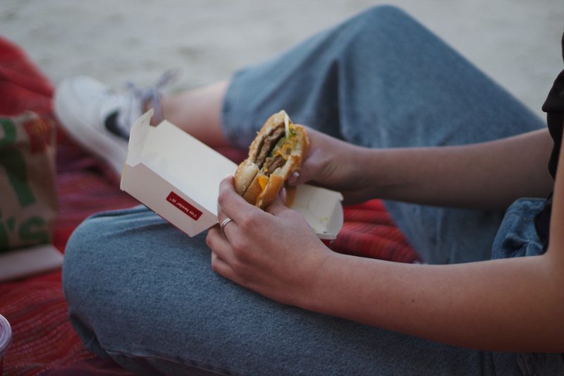 Person eating McDonald's burger