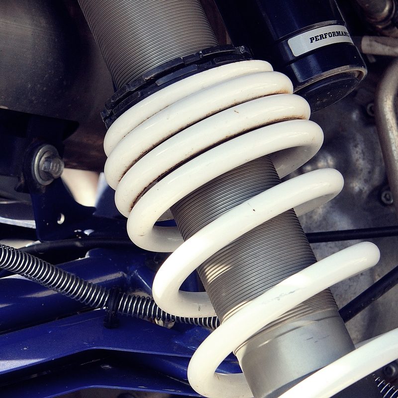 Coil spring car suspension