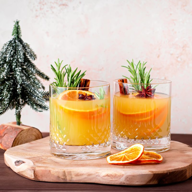 Bourbon cider cups next to Christmas decor