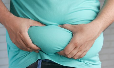 Man holding belly fat