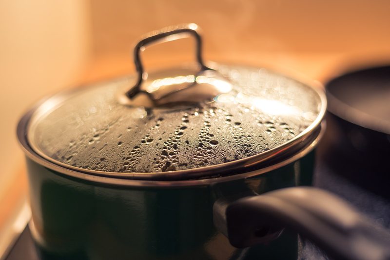 Pot with lid on stove