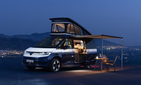 Volkswagen California campervan concept setup at camp with sleeper top open.