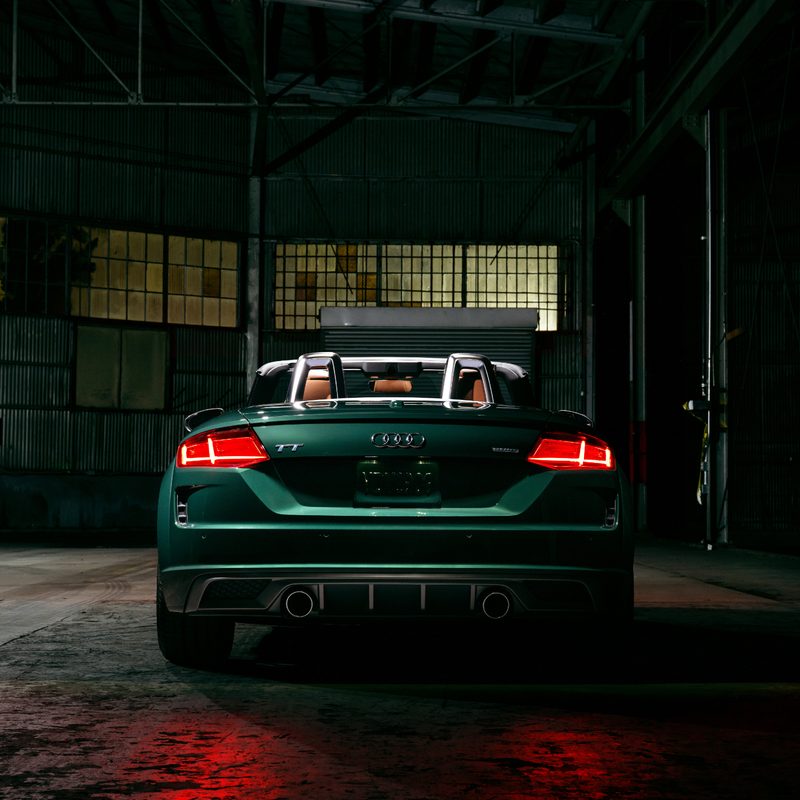2023 Audi TT Roadster Final Edition rear view of the green car in an empty warehouse