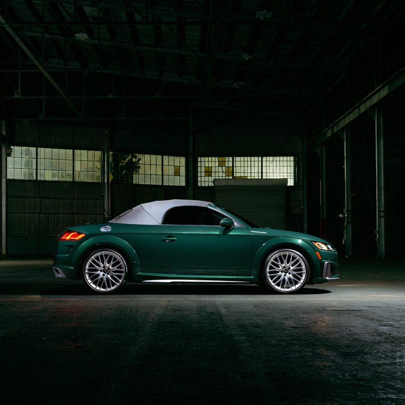 2023 Audi TT Roadster Final Edition right side view of the green car in an empty warehouse