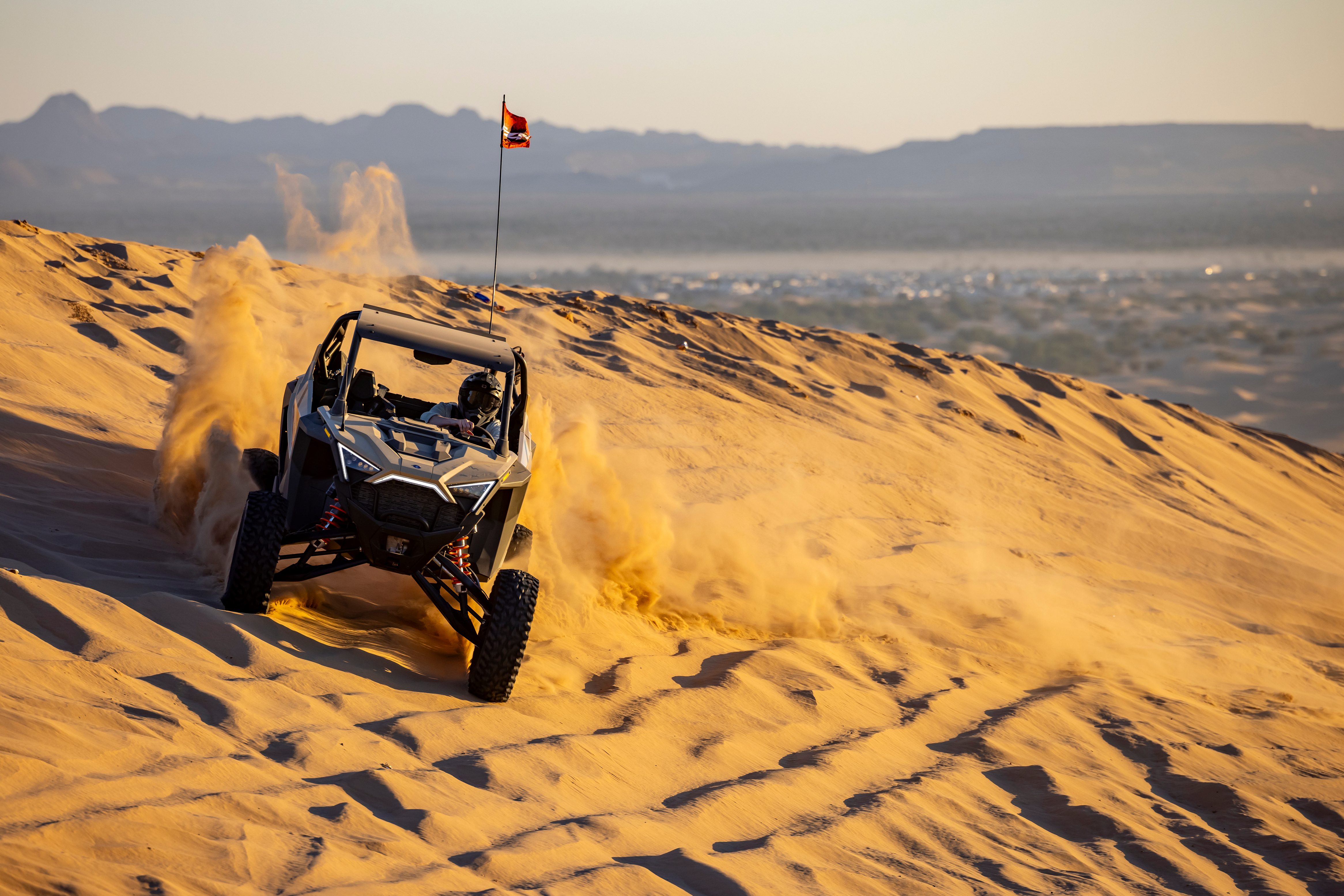 Driving a Rzr Pro R on a dune