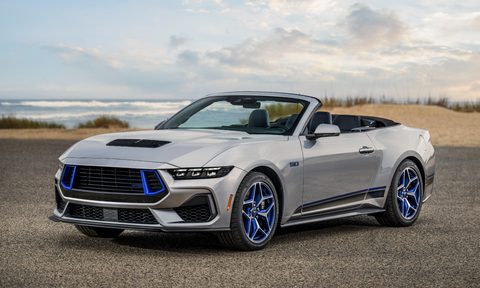 2024 Ford Mustang GT California Special convertible parked by the beach with the top down three-quarter view from the left front