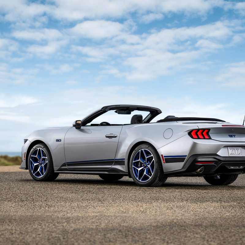 2024 Ford Mustang GT California Special convertible with the top down three-quarter view from the left.
