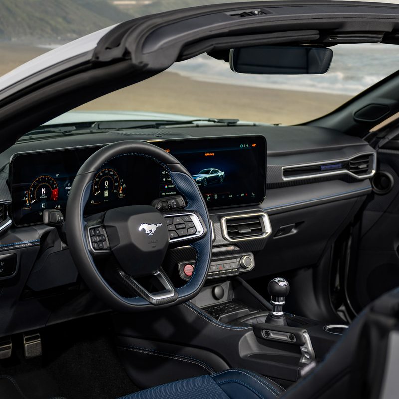 2024 Ford Mustang GT California Special interior view of the front seats from the left side withthe driver's door open.