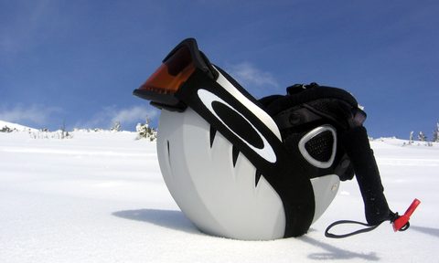 Ski helmet upside down on the snow