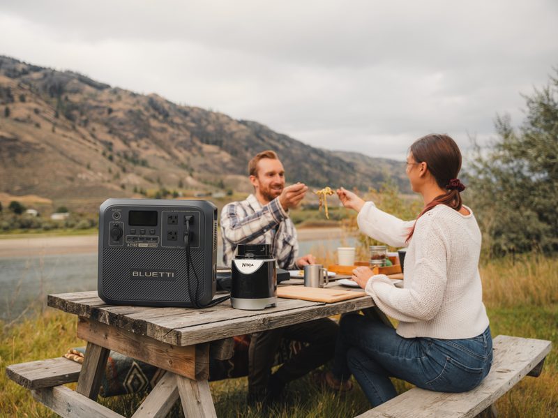 Bluetti AC180 power station powering date camping trip