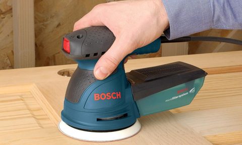 A corded Bosch Palm Sander with the Bosch logo clearly displayed.