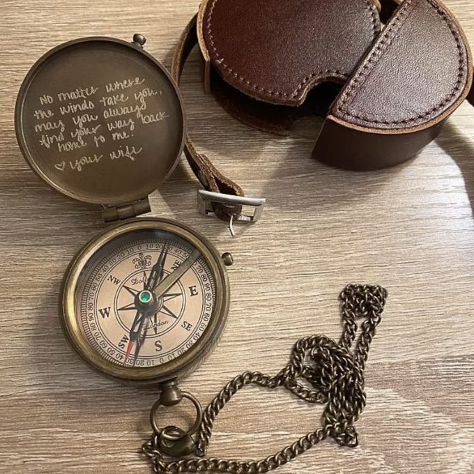 Compass with handwritten message engraved