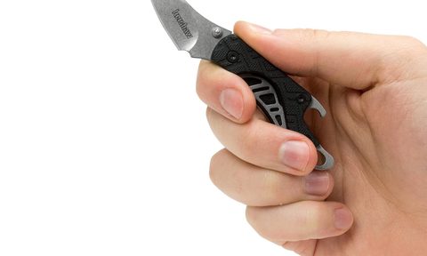 A man holding a Kershaw Cinder pocketknife.