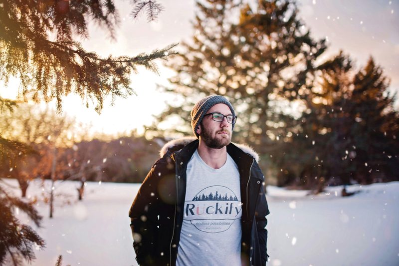 Man in the snow wearing a beanie