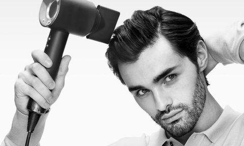 Man using the Dyson Supersonic Origin Hair Dryer
