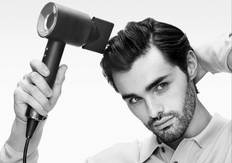 Man using the Dyson Supersonic Origin Hair Dryer