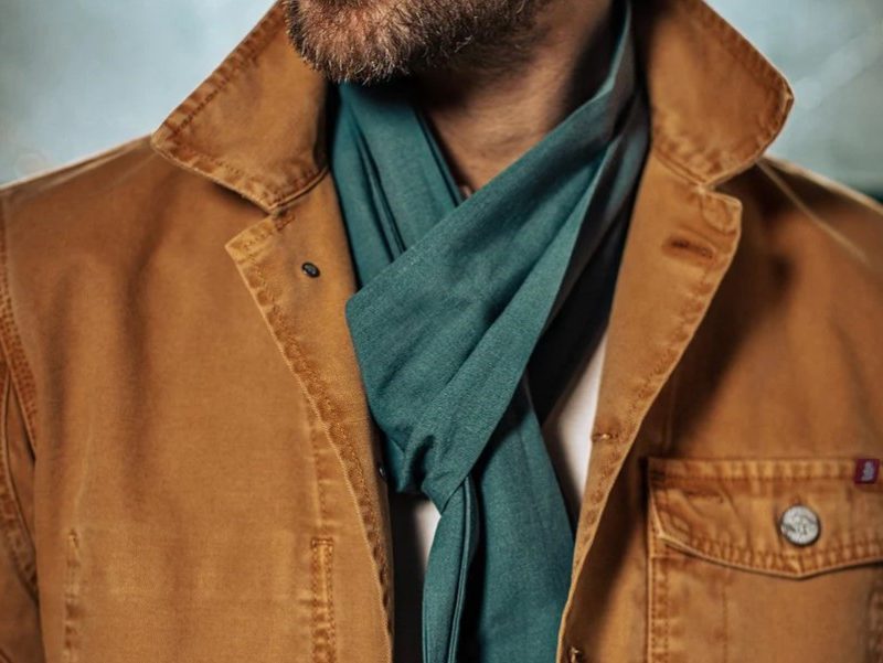 Man wearing &Sons Trading Sea Green Scarf