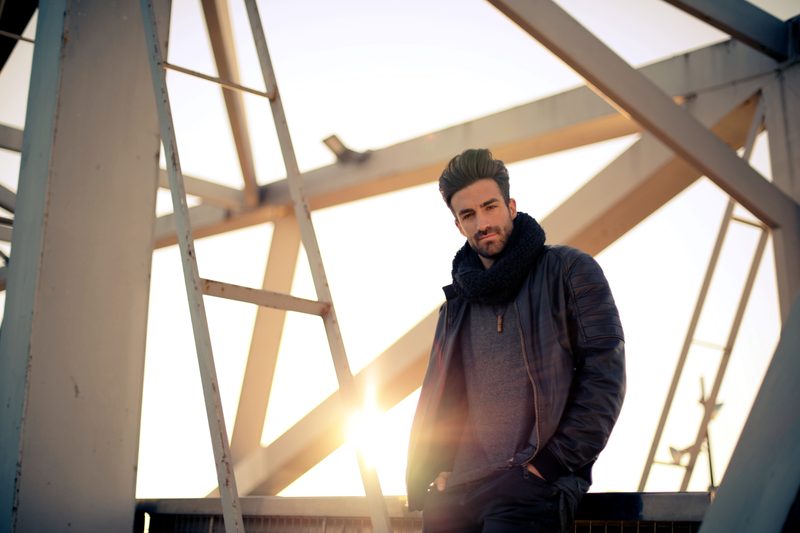 Man wearing scarf in the sunset