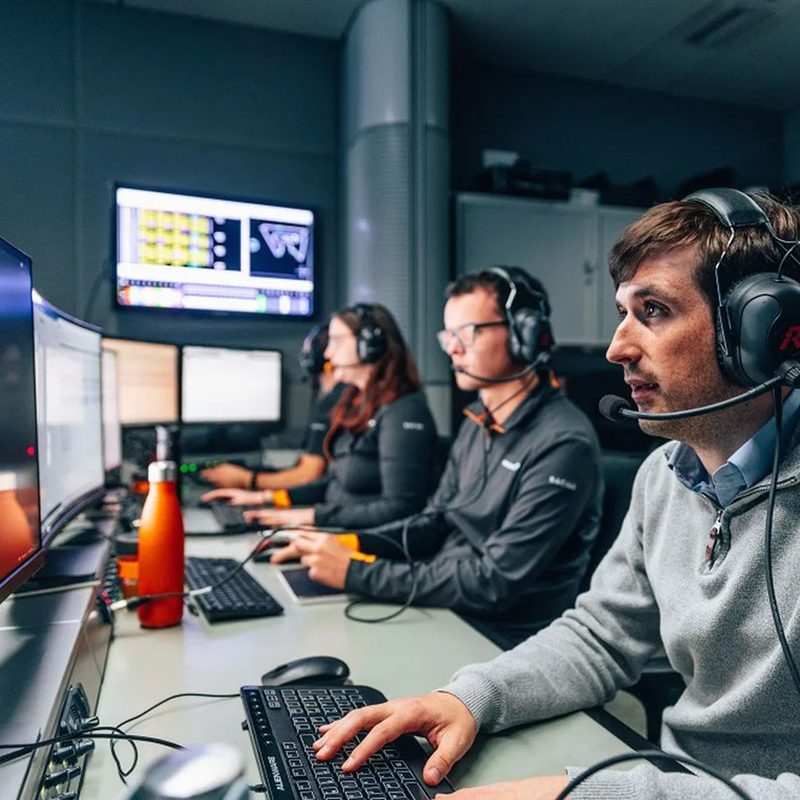 McLaren simulator performance engineers monitoring data during a F1 simulator run.