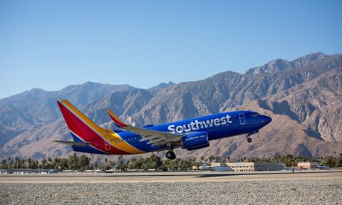 A Southwest Airplane takes off on the tarmac