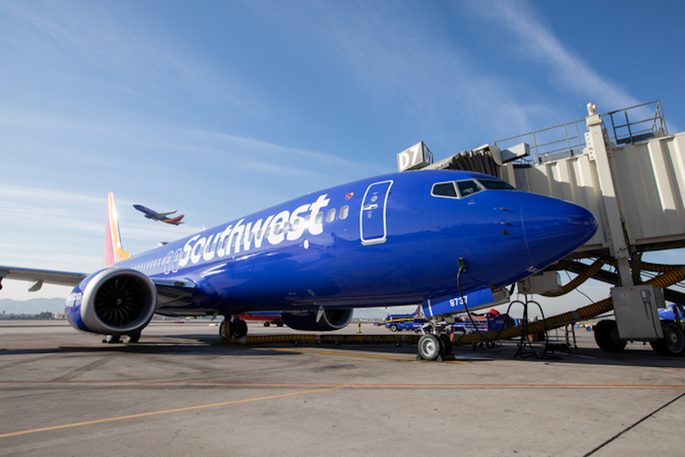 A Southwest Airlines Boeing 737 sits at a boarding gate.