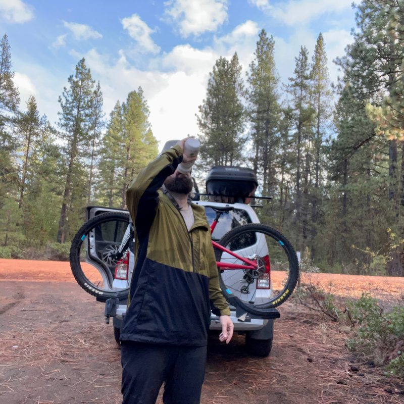 Rehydrating after a fall mountain bike riding wearing the Trew Gear Up Jack windbreaker
