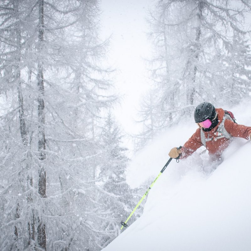 Skier going through deep snow