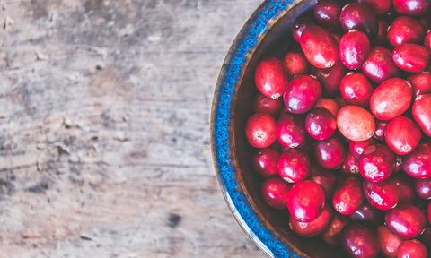 A blue bowl of cranberries