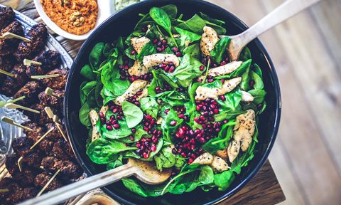chicken on a spinach salad
