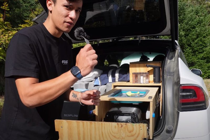 YouTuber Everyday Sandro showing off the mobile kitchen in his Tesla Model X.