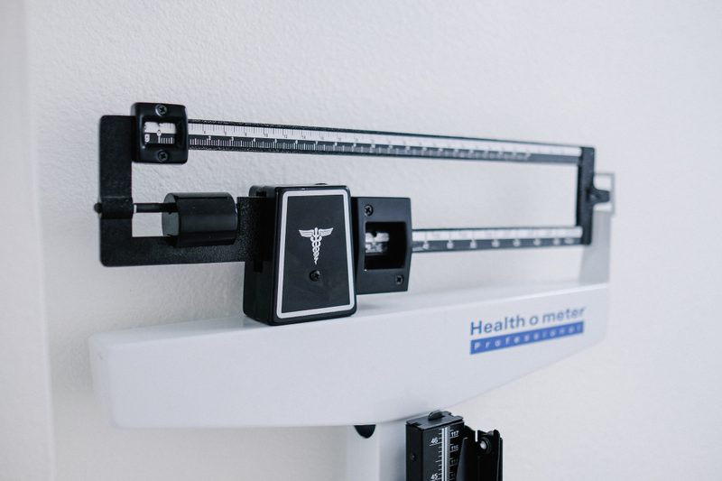 Weight loss scale black and white doctor office weighing scale