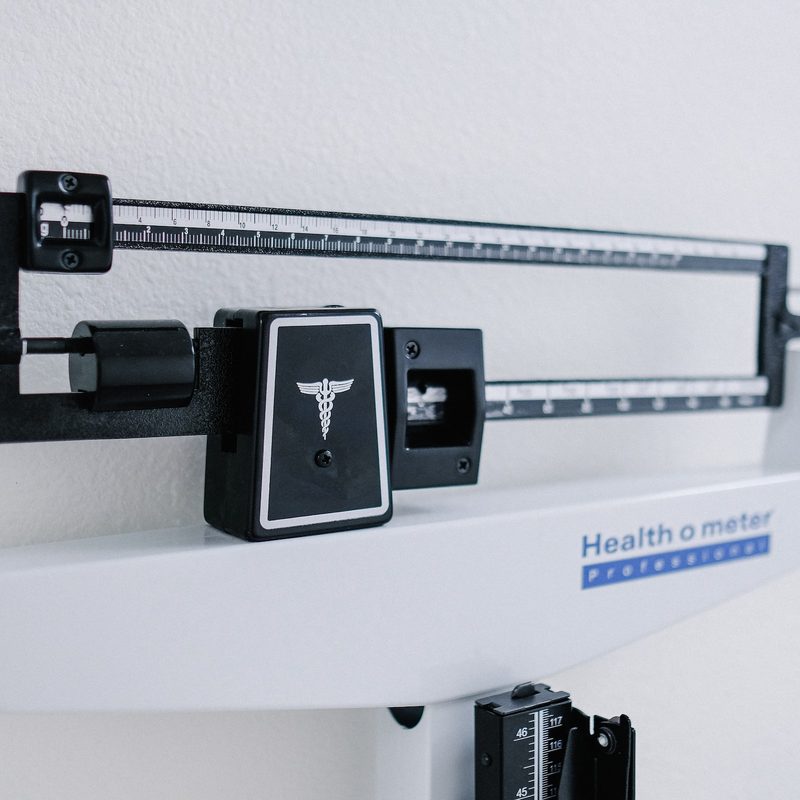 Weight loss scale black and white doctor office weighing scale