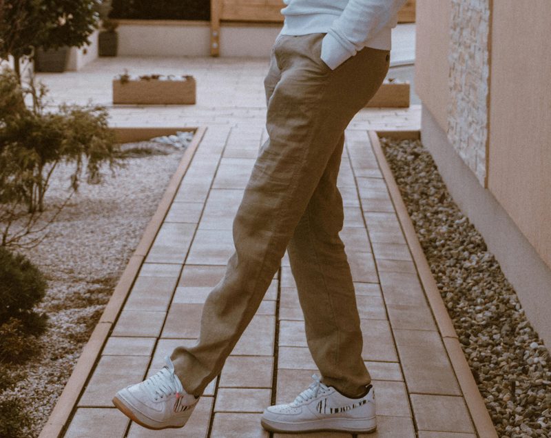 Man in khakis with white sneakers