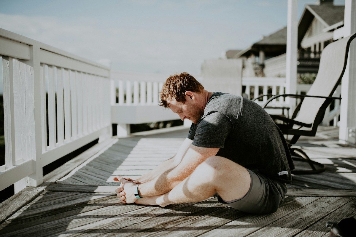 Man doing yoga on deck