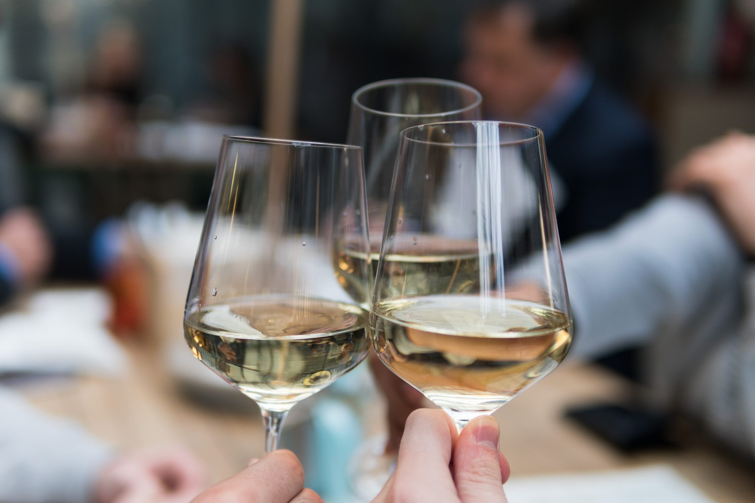 Three glasses of white wine together