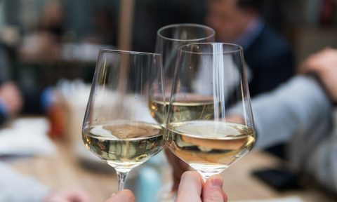 Three glasses of white wine together
