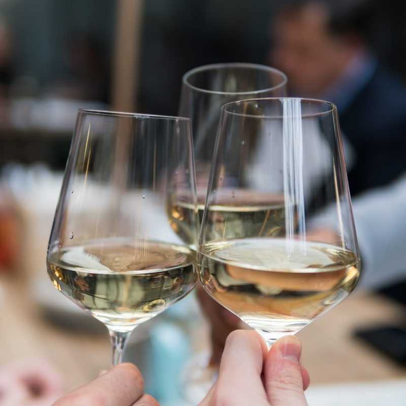 Three glasses of white wine together