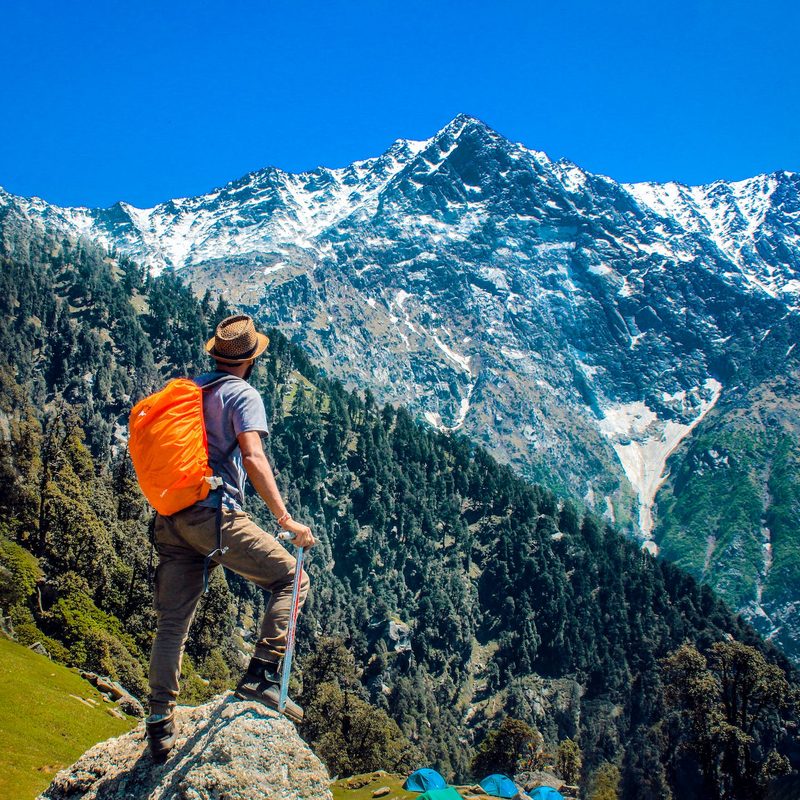 A man hiking to a mountain top