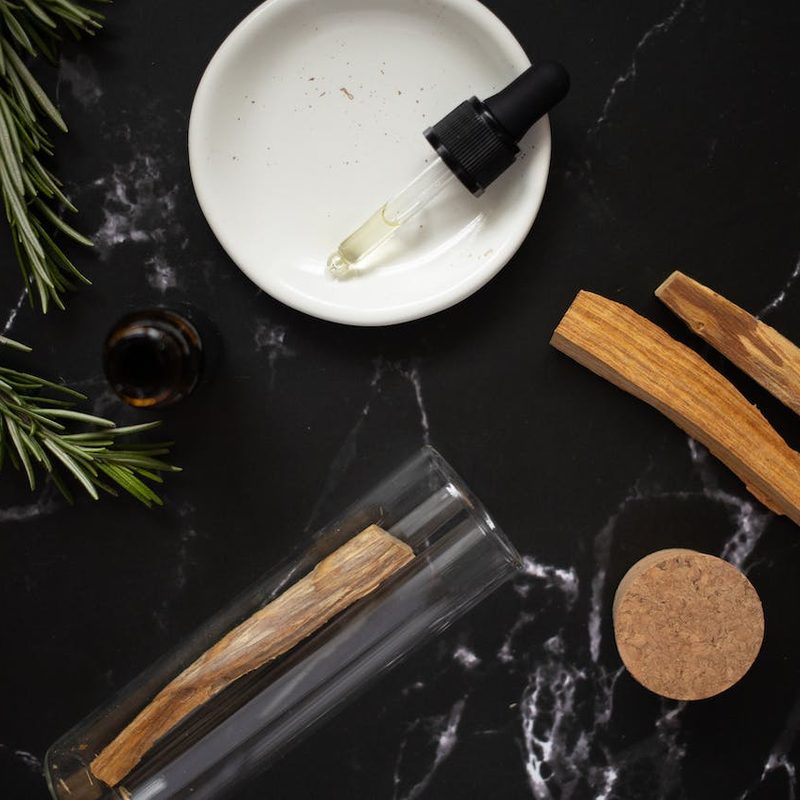 Rosemary oil with palo santo sticks