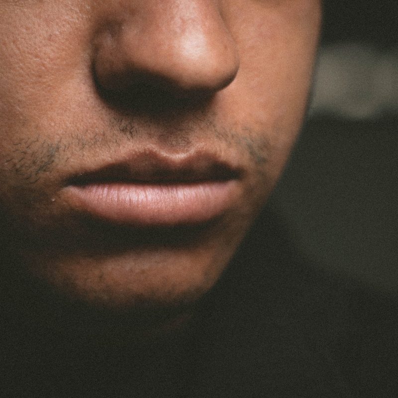 Close-up of man's lips and lower face