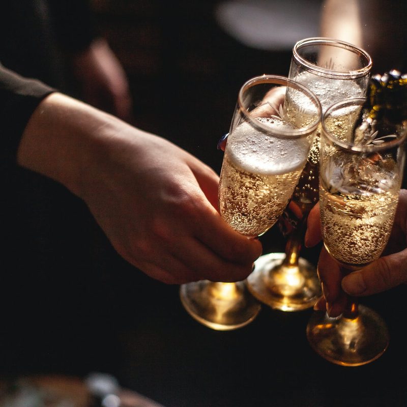 Hands toasting with Champagne
