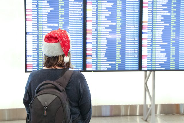 Woman looking at flight status