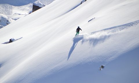 snowboard boots gift guide snowboarder on glacier