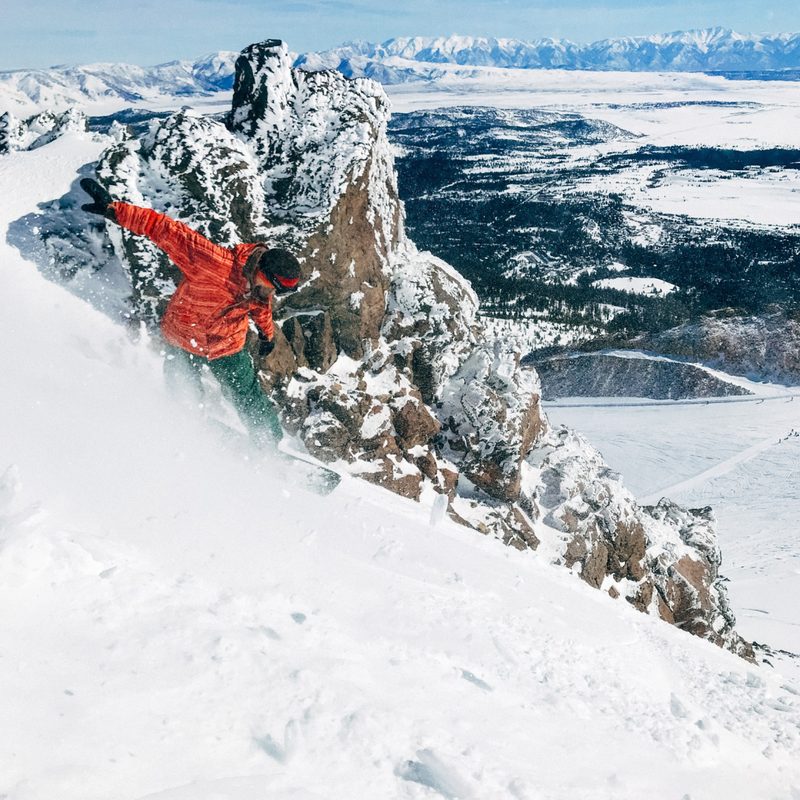 Snowboarder riding steeps
